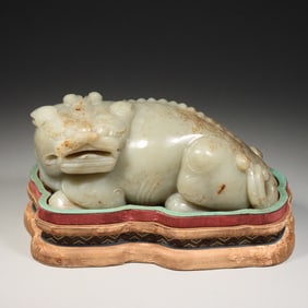 A large Hotan Jade seed carved auspicious animal decoration
