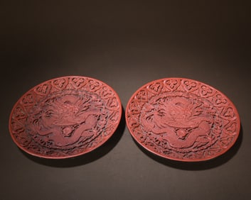 A pair of Qianlong painted dragon and pearl playing appreciation plates