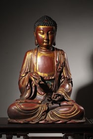 Seated statue of Shakyamuni in lacquered gold with wooden tire