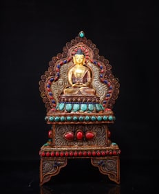 A piece of silver filigree inlaid with gemstone Shakyamuni Buddha