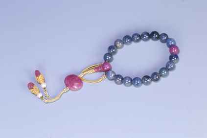 A sapphire paired with a ruby, 18 pieces handheld