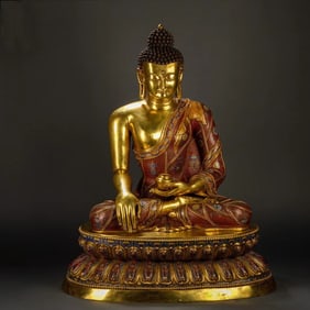 A piece of pinched wire enamel Buddha