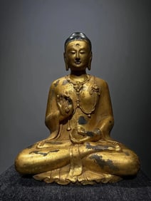 A Qing Dynasty bluestone Medicine Buddha (with a capital deposit)