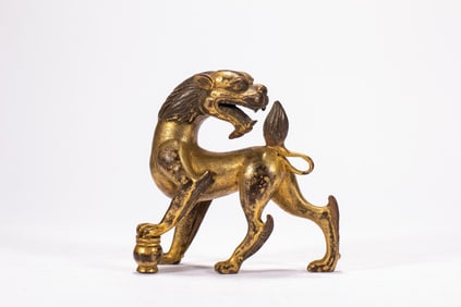 A bronze gilded beast