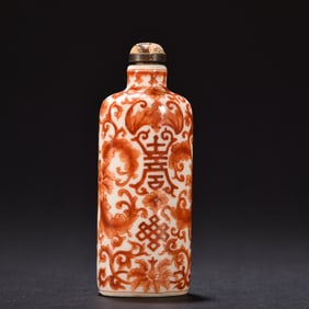 A porcelain body alum red longevity pattern snuff bottle