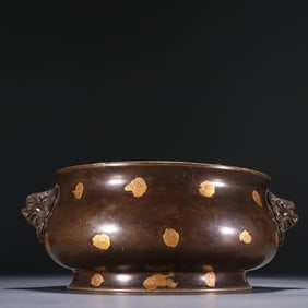 A Xuande Copper Dotted Gold Double Lion Beast Ear Incense Burner