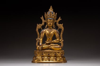 A copper gilded Buddha statue