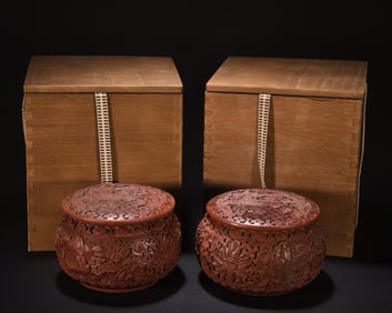 A pair of red lacquer carved character stories in Go jars