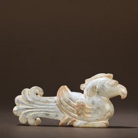 A carving of a phoenix with ancient jade