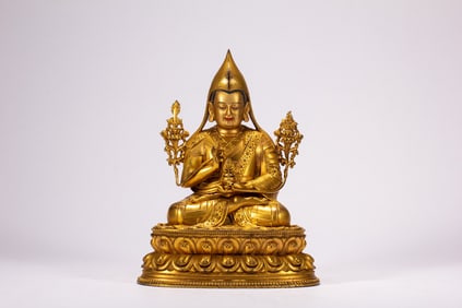 A copper gilded Buddha statue