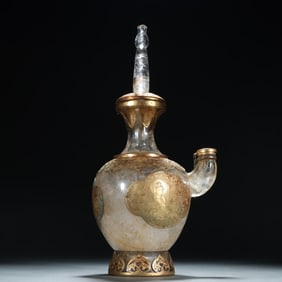 A white crystal wrapped gold clean bottle