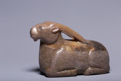 An ancient jade lying sheep ornament