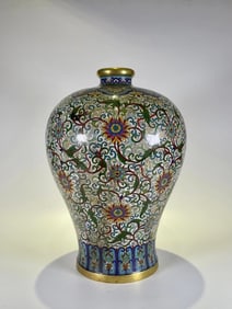A piece of pinched-wire enamel Plum bottle