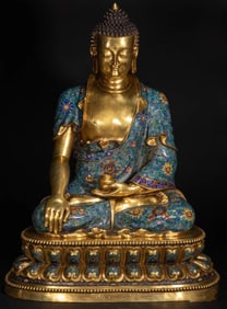 A piece of pinched wire enamel Buddha