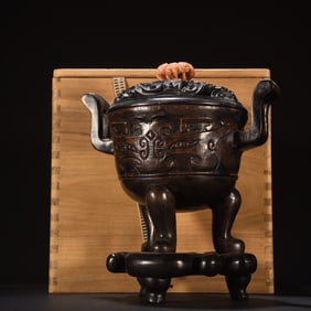 An old agarwood gluttony patterned incense burner with crown shaped ears