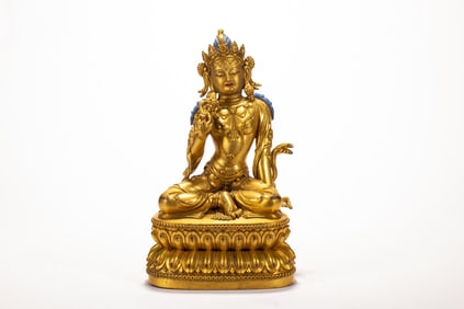 A copper gilded Buddha statue