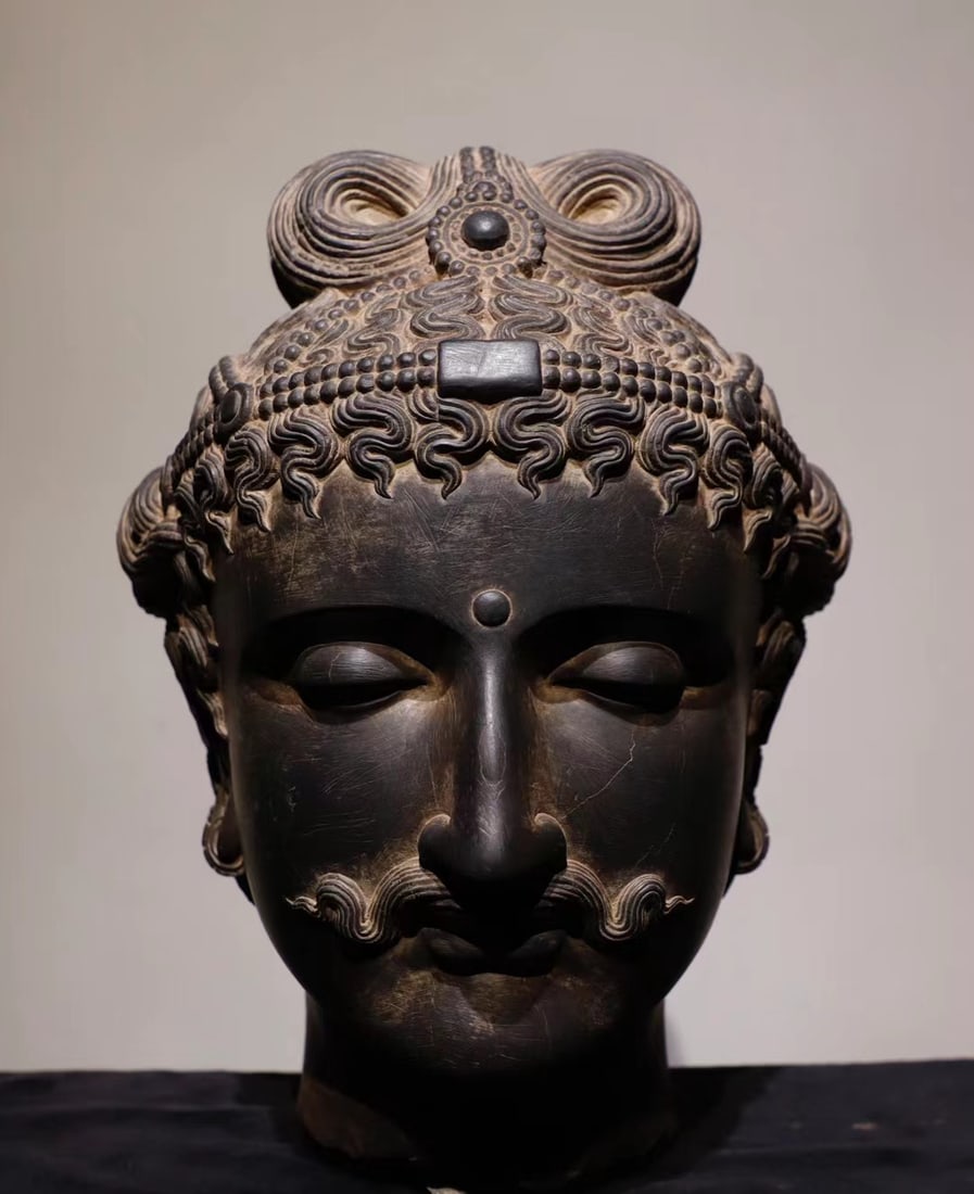 Schist Buddha head ornaments (1 of 9)