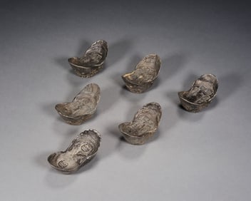 A set of 6 silver ingots