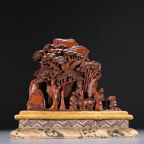 A sandalwood carved mountain figure ornament