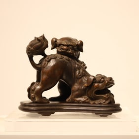 A agarwood double lion ornament