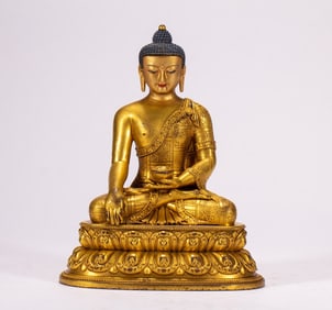 A copper gilded Buddha statue