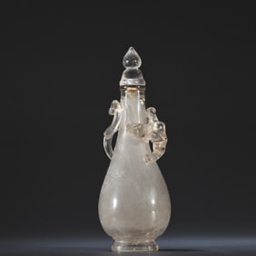 A crystal carved Chi Long patterned snuff bottle