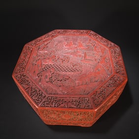 A red lacquer carved landscape painting octagonal box from the Qing Dynasty Qianlong period
