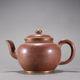 A famous purple clay wrapped silver gilded teapot