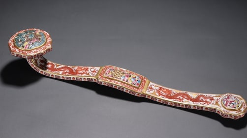 A Ruyi ornament with a golden dragon pattern painted in alum red