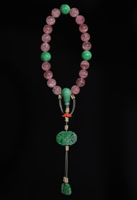 18 pieces of pink tourmaline held in hand