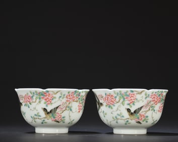 A pair of pink flower and bird patterned cups