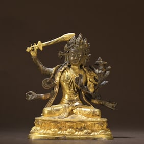 A Qing Dynasty bronze gilt Manjushri ornament