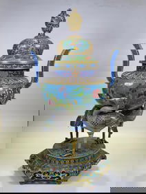 A piece of pinched-wire enamel three-crane tripod stove