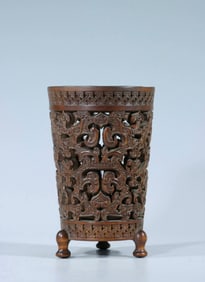 A boxwood carved hook lotus pattern three legged pen holder