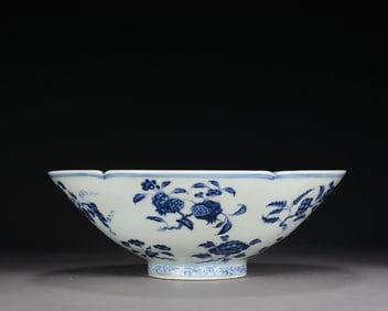 A blue and white folded branch bowl