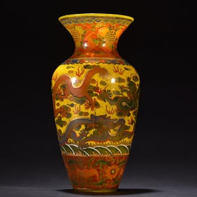 A decorative bottle with enamel cloud and dragon patterns painted on a material tire