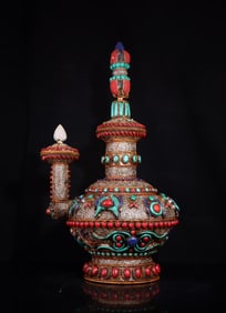 A silver filigree inlaid gemstone bottle for eight babies