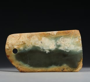 A tall antique jade axe