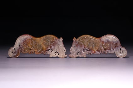 A pair of antique jade tiger carvings