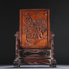 An inset of a boxwood carved landscape character picture