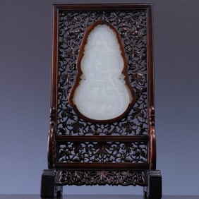 A red sandalwood inlaid with Hotan Jade and a lucky gourd landscape character screen insert