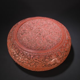 A red lacquer carved dragon and phoenix auspicious box