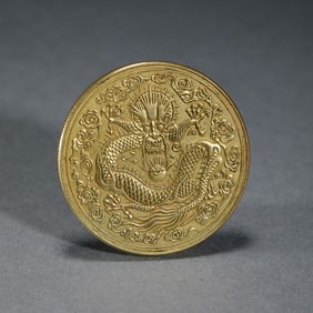 A silver gilded gold coin