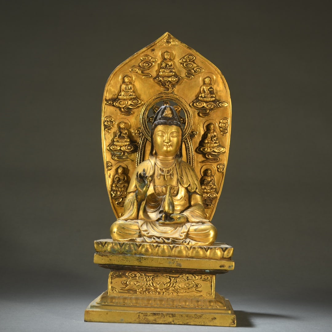 A bronze gilt net bottle of Guanyin seated: Bronze gilt net bottle Guanyin seated statue Size: H:32.3cm W:15.5cm W:3.45kg (The dimensions of all batches are manually measured.If you need more detailed information, please contact our customer se