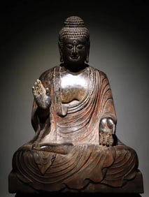 A Tang Dynasty bluestone painted Buddha seated statue