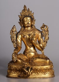 A seated statue of a bronze gilt green Tara from the Qing Dynasty