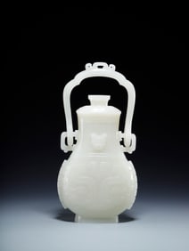 A piece of Hetian jade beast face pattern handle bottle