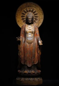 A large bluestone painted Buddha statue from the Tang Dynasty