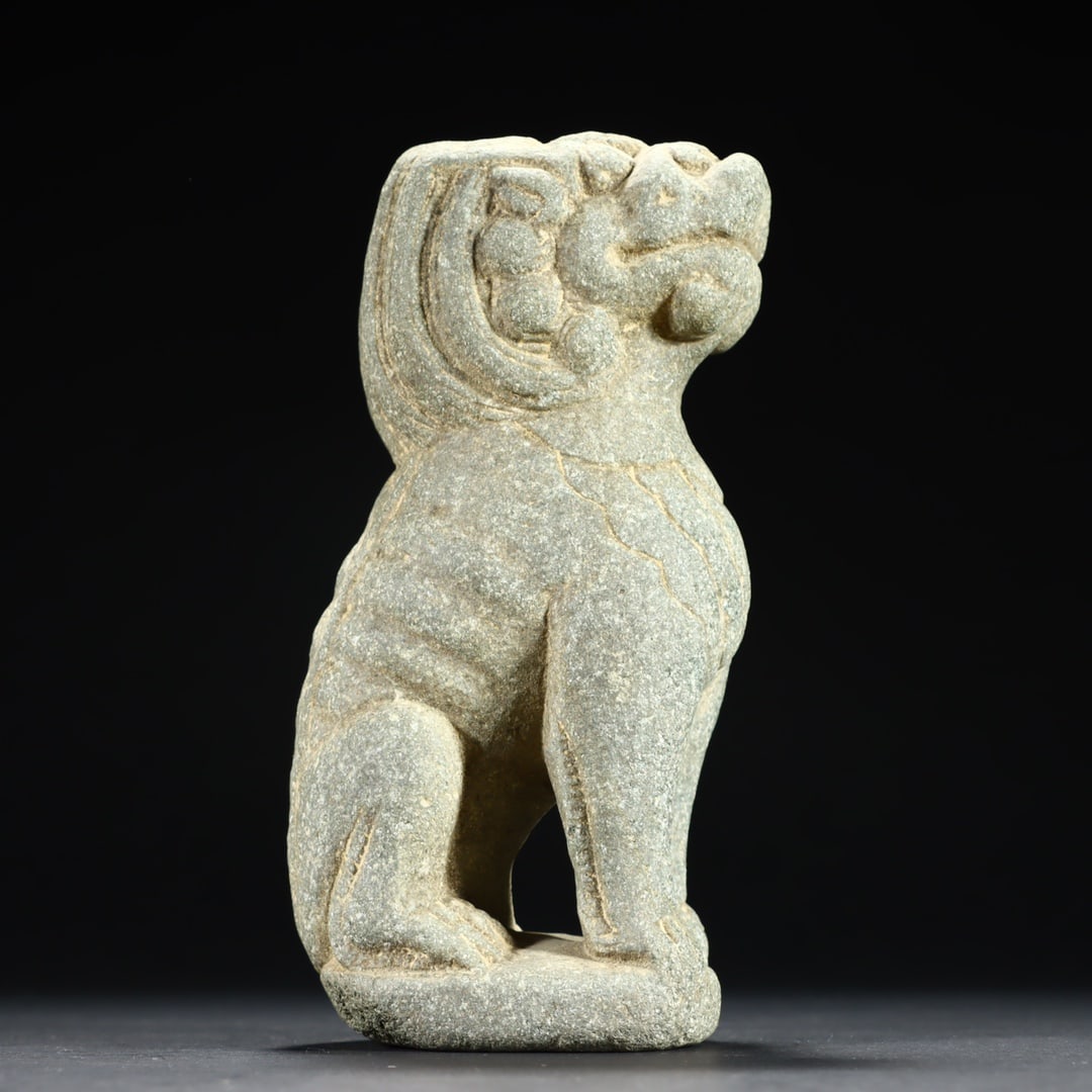 A small stone lion on the desk (1 of 9)
