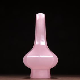 A piece of pink glass octagonal bottle